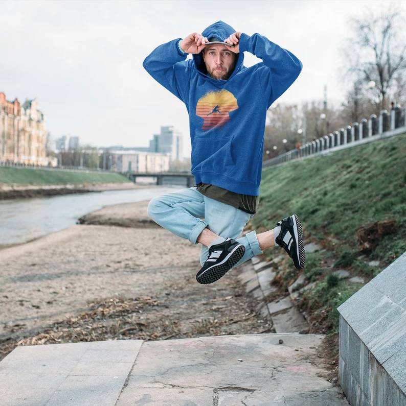 Blue hoodie with a retro sunset and silhouette graphic